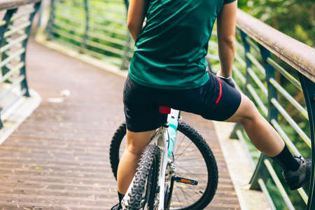Woman freerider  riding bike in parkの写真素材