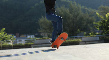 Skateboarder skateboarding outdoors in cityの写真素材