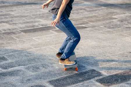 Skateboarder skateboarding outdoors in cityの写真素材