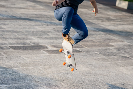 Skateboarder skateboarding outdoors in cityの写真素材