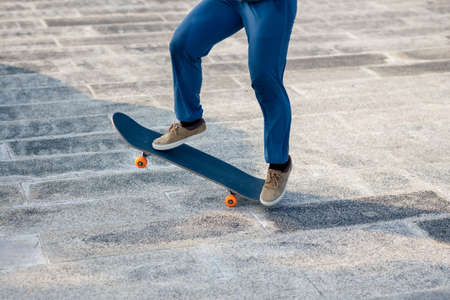 Skateboarder skateboarding outdoors in cityの写真素材