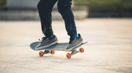 Skateboarder skateboarding outdoors in cityの写真素材