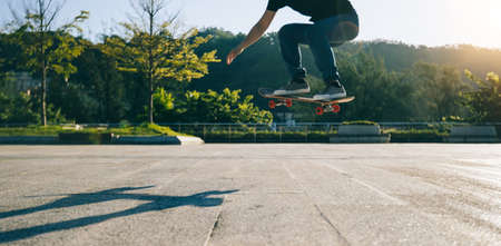 Skateboarder skateboarding outdoors in cityの写真素材