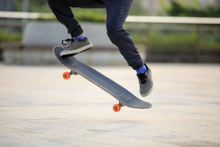 Skateboarder skateboarding outdoors in cityの写真素材