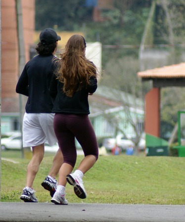 a young couple running                    の写真素材