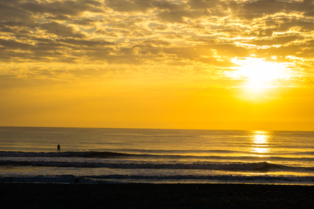 Man Paddle Surfing at Sunrise の写真素材