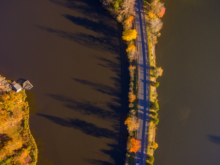 Aerial View of Fall Leaves and Colors around a Lakeの写真素材