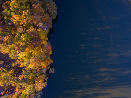 Aerial View of Fall Leaves and Colors around a Lakeの写真素材