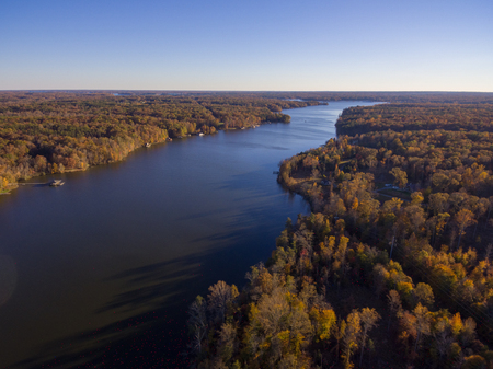 Aerial View of Fall Leaves and Colors around a Lakeの写真素材