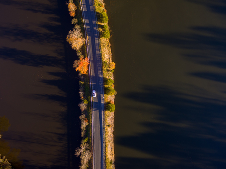 Aerial View of Fall Leaves and Colors around a Lakeの写真素材