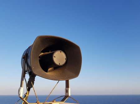 megaphone on the background of the sea and the blue skyの写真素材