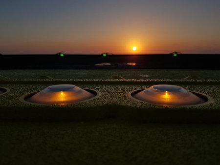 Helicopter circle warning lamps installed on the ship heli-deck. Sunset background.の写真素材