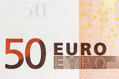 Macro shot of a fifty euro bill showing the words 50 euro