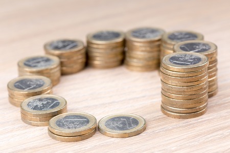 Circle of coins increasing in stack sizeの写真素材