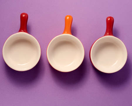 Colored ceramic frying pans for food presentationの写真素材