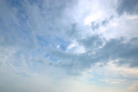 Beautiful fluffy white clouds float across the blue sky. background. Banner. Screensaver on the...