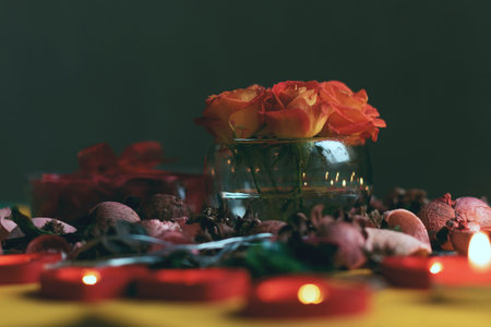 Bouquet of roses, candles and gifts, card for February 14, St. Valentine, March 8, wedding, birthday, mother's day, blurred background, bokeh.の写真素材