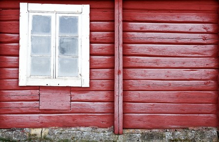 Frosty red timber wall with old window.の写真素材