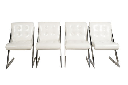 Row of white chairs isolated on white background. Clipping path included.の写真素材