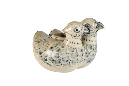 Ceramic figurine of a bird on a white background.の写真素材