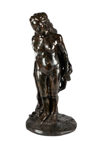Bronze statuette of a woman on a white background.の写真素材