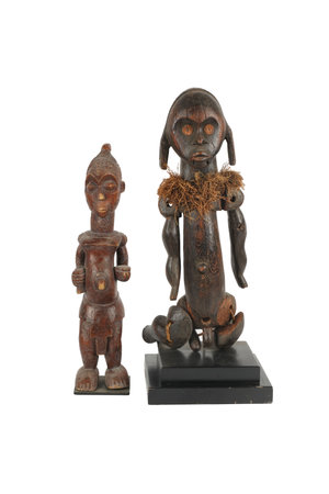 Wooden monkey and monkey figurine isolated on a white background.の写真素材