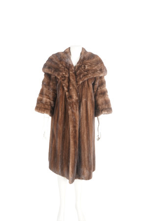 fur coat on mannequin on white background with clipping path.の写真素材