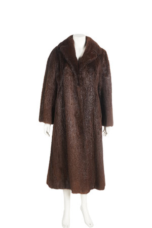 Mink coat on a mannequin. Isolated on a white background.の写真素材