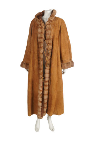 fur coat on a mannequin isolated on a white background.の写真素材