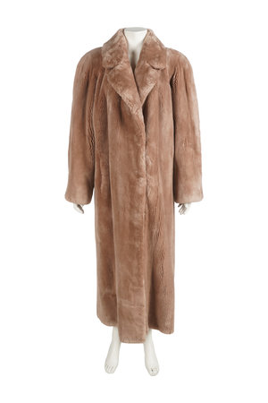 brown fur coat on mannequin isolated on a white background.の写真素材