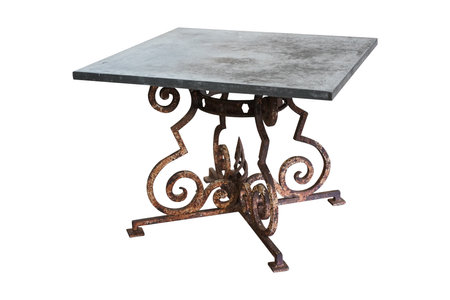 Old forged table isolated on white background. Clipping path included.の写真素材