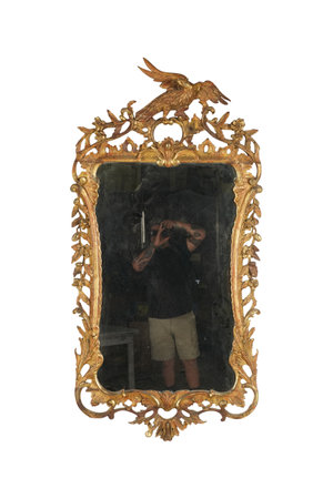 Mirror with a picture of the man and the bird on a white backgroundの写真素材