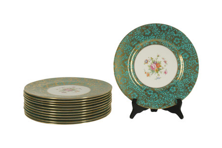 Antique porcelain plate and gold plates isolated on white backgroundの写真素材