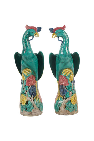 Ceramic figurine of two birds on a white background.の写真素材