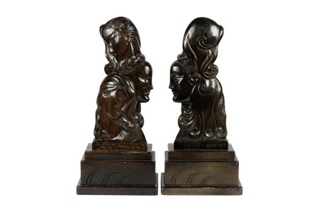 wooden figurines of a mother and child on a white backgroundの写真素材