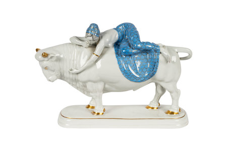 Plastic statuette of a bull on a white background.の写真素材