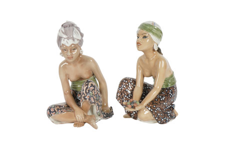 Ceramic figurine of two women, isolated on white backgroundの写真素材