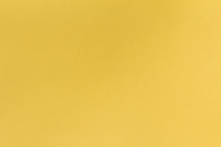Yellow artificial leather texture as a backgroundの写真素材