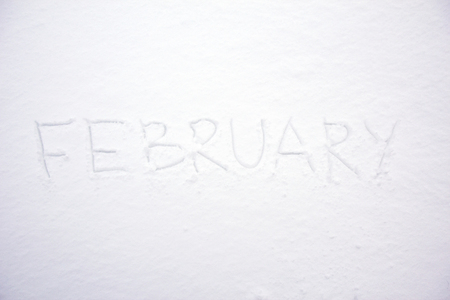 February month hand written text on snowの写真素材