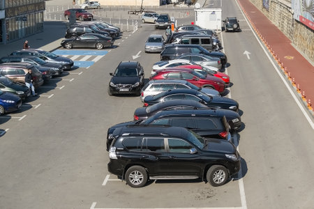 Varna, Bulgaria, February 20, 2019. Outdoor car parking with a barrier around the sea port of Varna on a sunny day.のeditorial素材