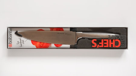 Varna, Bulgaria, March 14, 2019. Brabantia chef knife made of high carbon molybdenum vanadium steel. Professional sharp kitchen knife with 20 cm (8 inch) blade on a white background top view.のeditorial素材