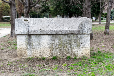 Ancient stone sarcophagus in the park. Antique stone tombs are located in a public park next to the Archaeological Museum in Varna. Tourist attractions and landmarks.のeditorial素材