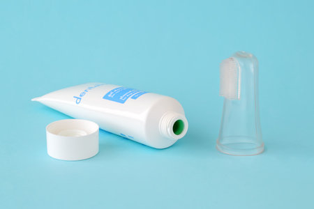 Varna, Bulgaria, September 12, 2019. Opened tube of veterinary gel Dentalmax for prevention plaque and halitosis and for tooth enamel strengthening. Toothpaste and silicone toothbrush for dogs and cats. Pet health care.のeditorial素材