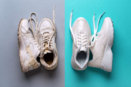 Pair of old dirty white sneakers on a gray background and pair of new white sneakers on a marin blue...