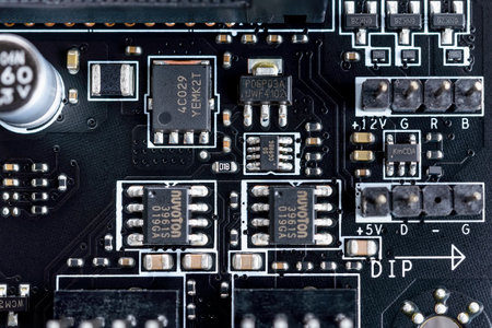 Varna, Bulgaria, January 08, 2021. Electronic circuit board with microchips and other components on a modern black motherboard. Computer mainboard circuit components. Desktop hardware macro.のeditorial素材