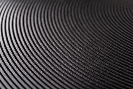 Macro texture of electric stove heating disk. Black heating element of hot plate cooktop background. Electric burner surface for cooking. Selective focus. Close-up.の写真素材