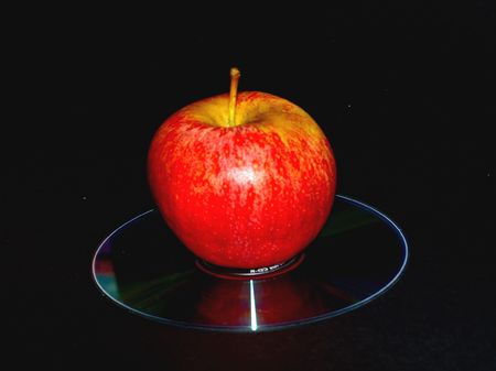 Apple with Disc on blackの写真素材