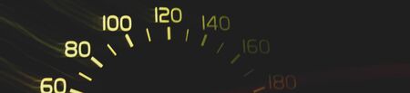 Driver's cockpit; speedometer on dashboard - colorful light in black, copy space for your designの写真素材