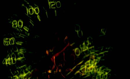 Driver's cockpit; speedometer on dashboard - colorful light in black, copy space for your designの写真素材