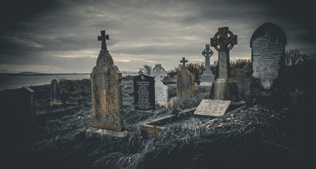 Ireland celtic cross at medieval church cemetery Old spooky cemetery. Haunted cemetery. Scary place. Old gravesの写真素材